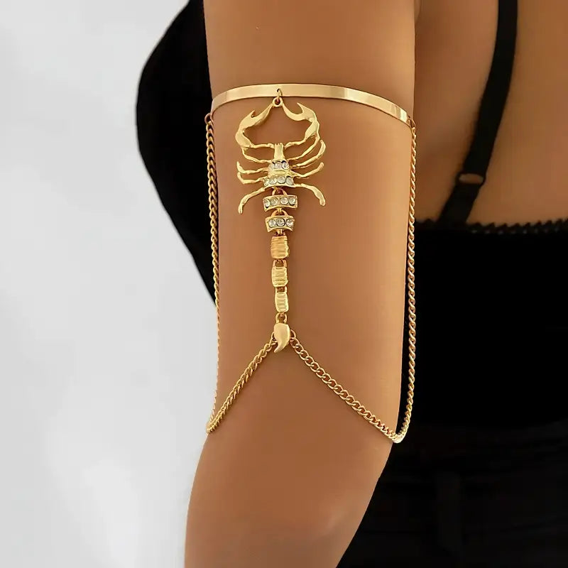 Scorpion arm bracelet worn by a woman.